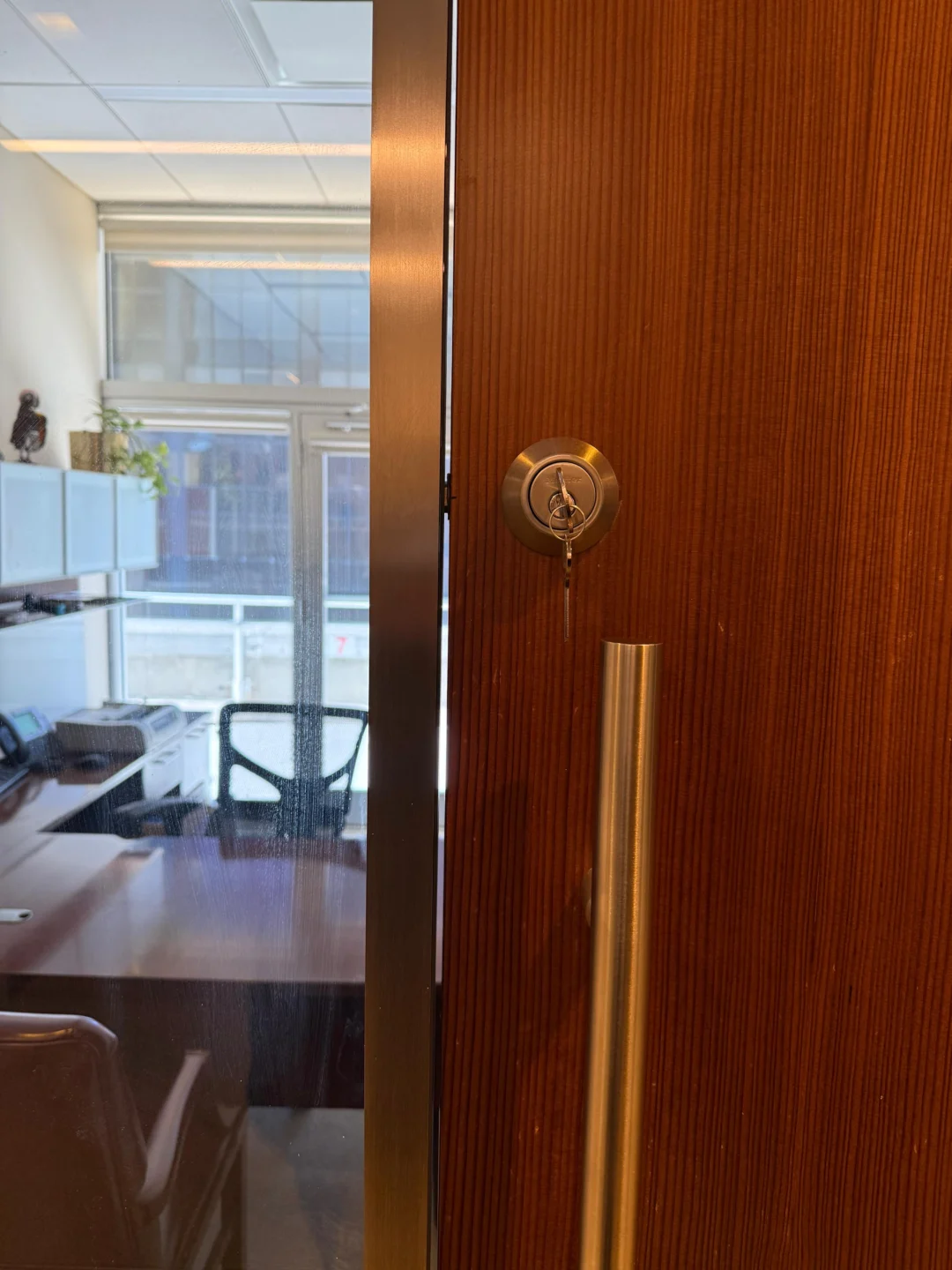 Checking door and frame alignment at the latch on an NYC office door