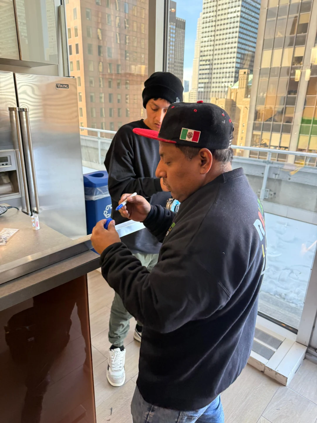 Rainbow Locksmith technicians servicing electronic door hardware in NYC