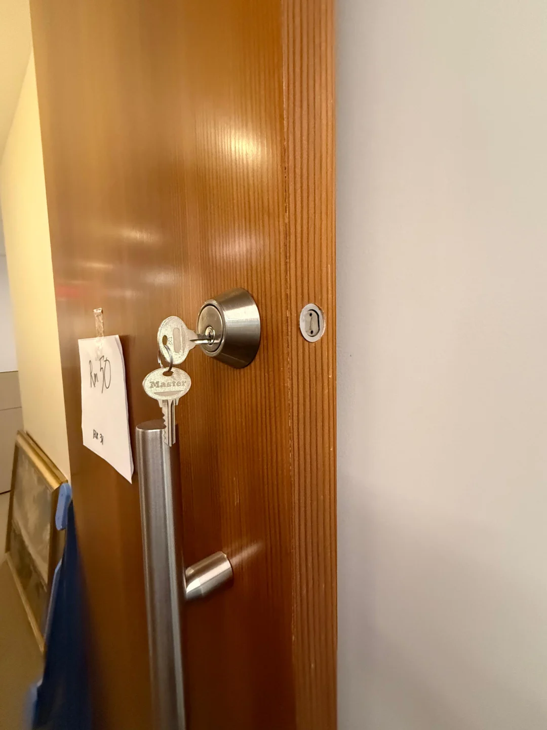 Lock cylinder and keys re-secured after coming loose on an NYC door