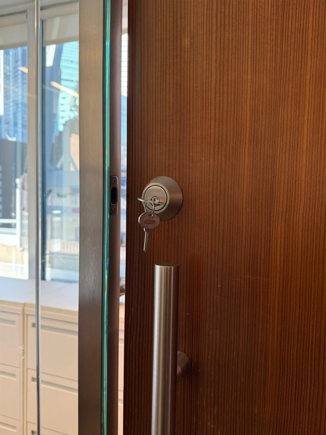 New deadbolt cylinder with keys installed on an NYC door