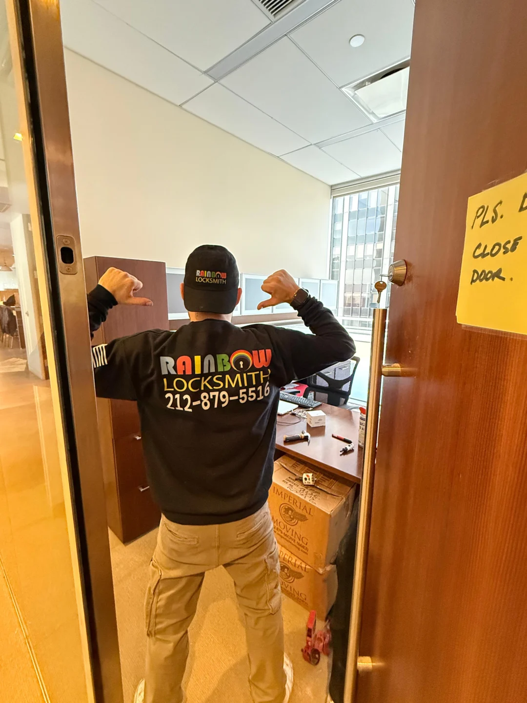 Rainbow Locksmith technician troubleshooting a door lock in NYC