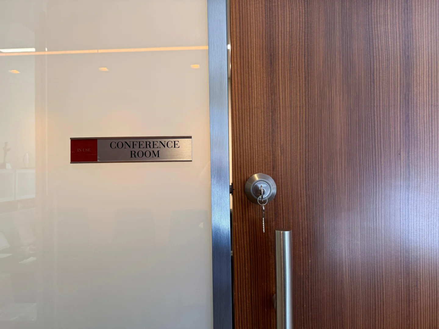 Testing a conference room door lock with the key in an NYC office
